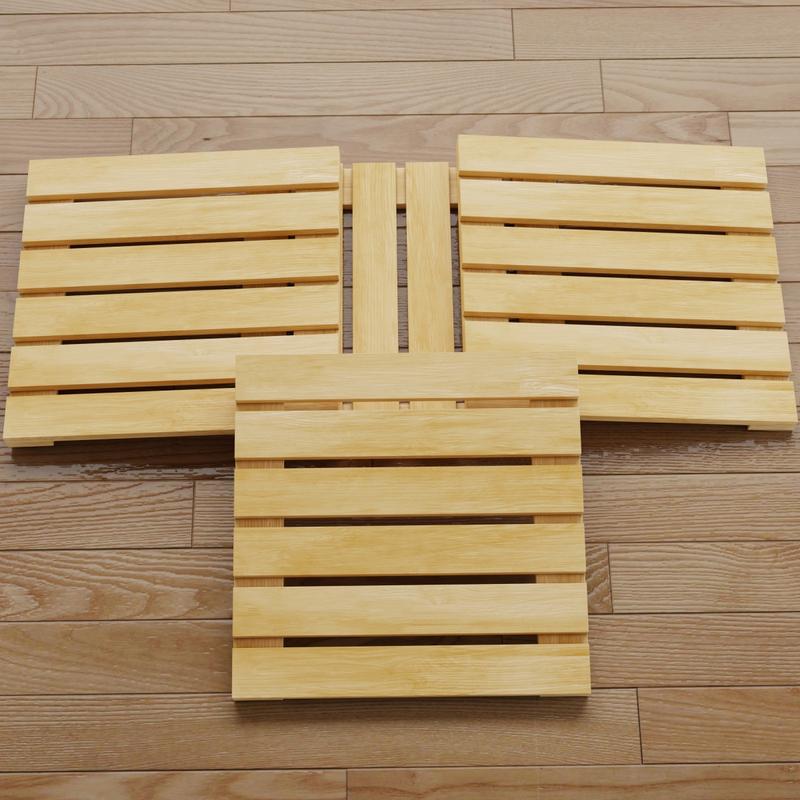 alt="18490 Callebotise Teak Floor Tiles showing closeup view of 4 teak tiles on wood floor"