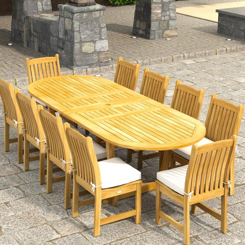 alt="70166 Montserrat Veranda 11pc Dining Set with optional cushions on patio in angled aerial end view with pergola with hanging plants and vines and plants and hillside in background"