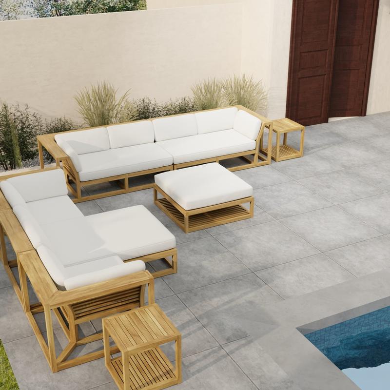 alt="70233 Maya 7 pc Sectional Furniture Set in aerial view on a patio next to a pool with landscape plants and a privacy wall and door in the background"