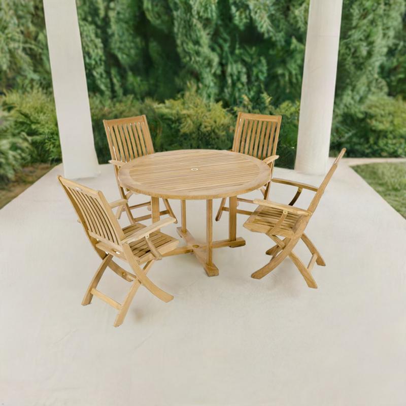 alt="70536 Barbuda 5 piece Dining Set of Barbuda Teak 48 inch round dining table and 4 Barbuda folding armchairs aerial angled view on a patio with 2 pillars and landscaping plants in the background"