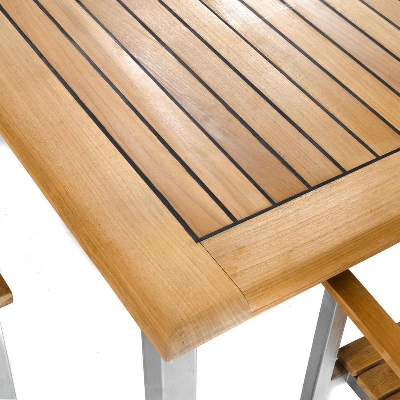 alt="25025 Vogue Teak and Stainless Steel Rectangular Extension Table showing closeup of table top with sikaflex marine sealant between teak slats on white background"