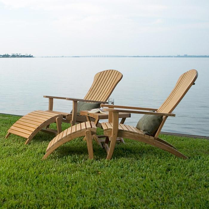 alt="70000 two Adirondack Chair with footrest and cushions side view on green grass in front of lake"