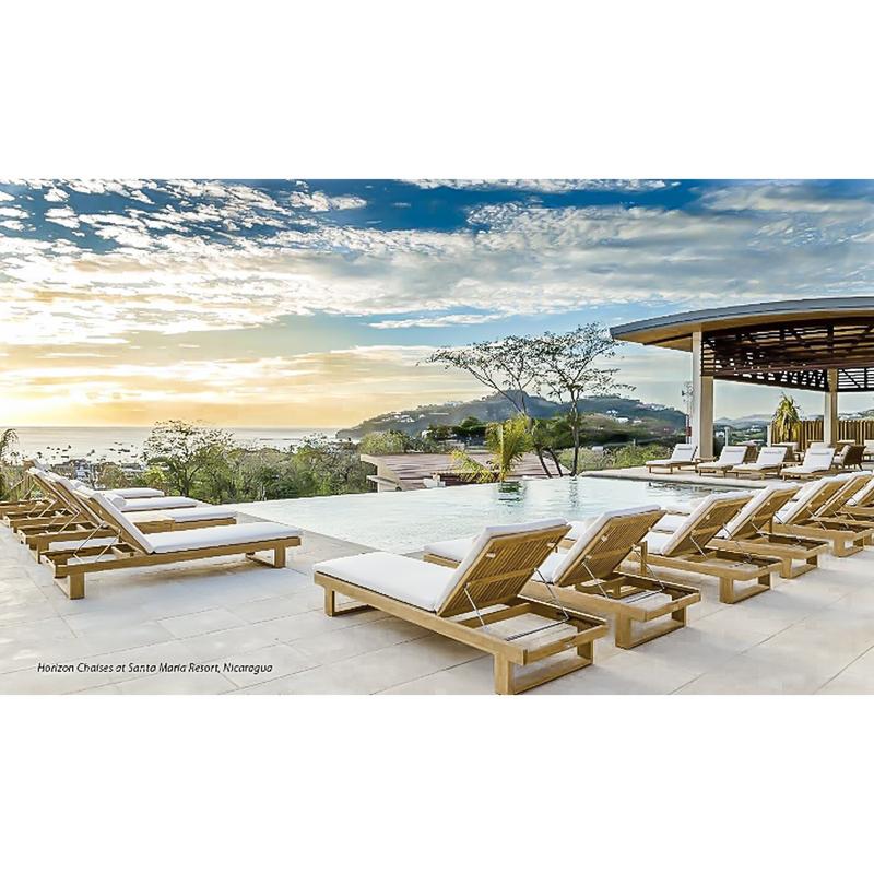 alt="16770 Horizon Teak Chaise Loungers on pool terrace pergola on right loungers overlooking ocean and sunset in background"