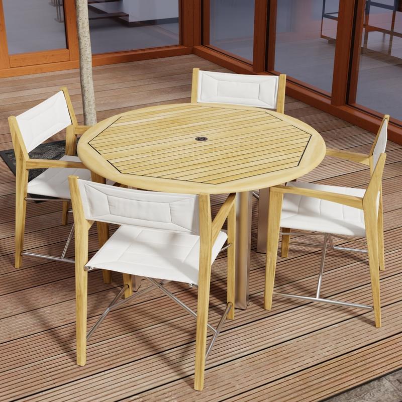 alt="70619 Vogue Odyssey 5 pc Round Dining Set of Vogue Dining Table and 4 Odyssey Folding Chairs angled aerial view on patio with glass doors in the background "