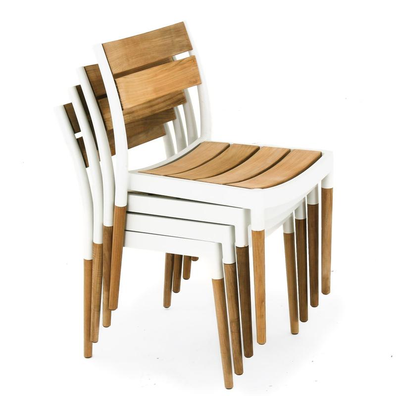alt="70449 Bloom teak and powder coated aluminum dining chair stacked 4 high angled side view on white background"