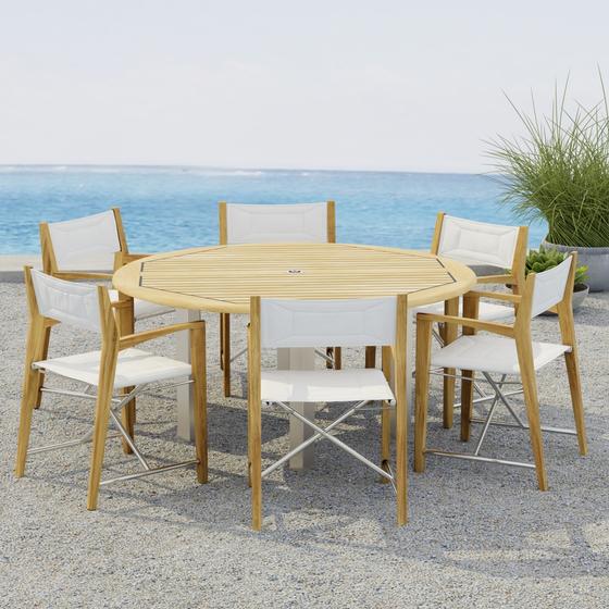 70359  Vogue Odyssey 7 pc Dining Set showing Vogue 5 ft Round Table and 6 Odyssey Chairs on terrace angled side view with 2 potted plants and ocean in the background