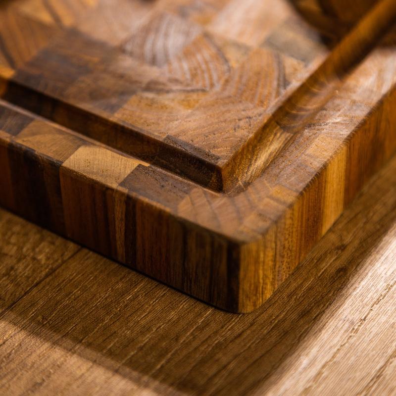 alt="19123 Butcher Block 17 inch x 11 inch Rectangle Charcuterie Cutting Board angled view of corner on a table top"