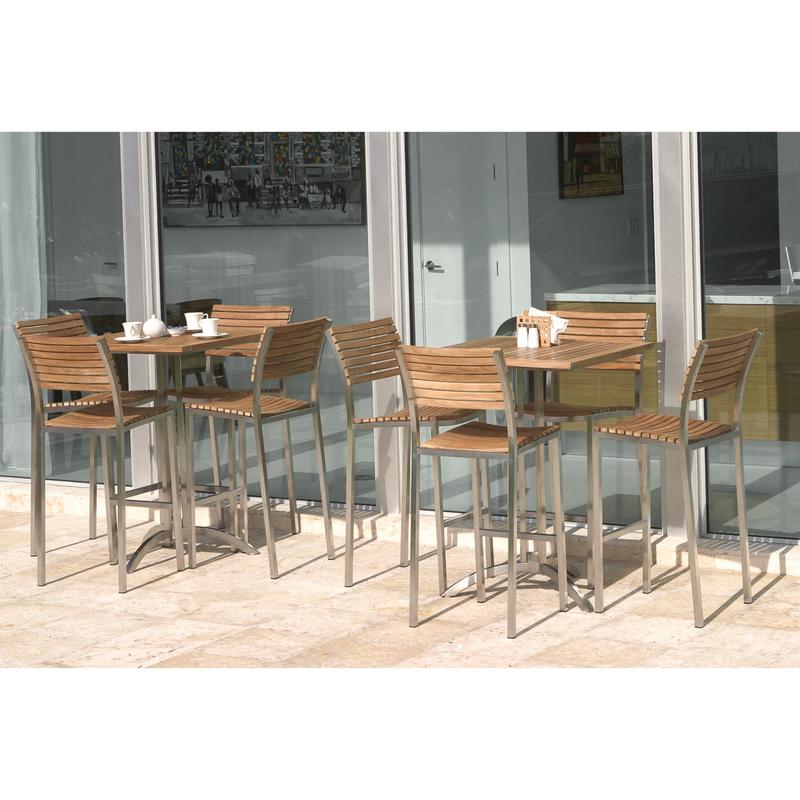 alt="0075 Vogue High Bar Set two sets with 3 tea cups and tea pot on one set and condiments and napkin holder on another set on concrete patio with glass sliding doors in background"