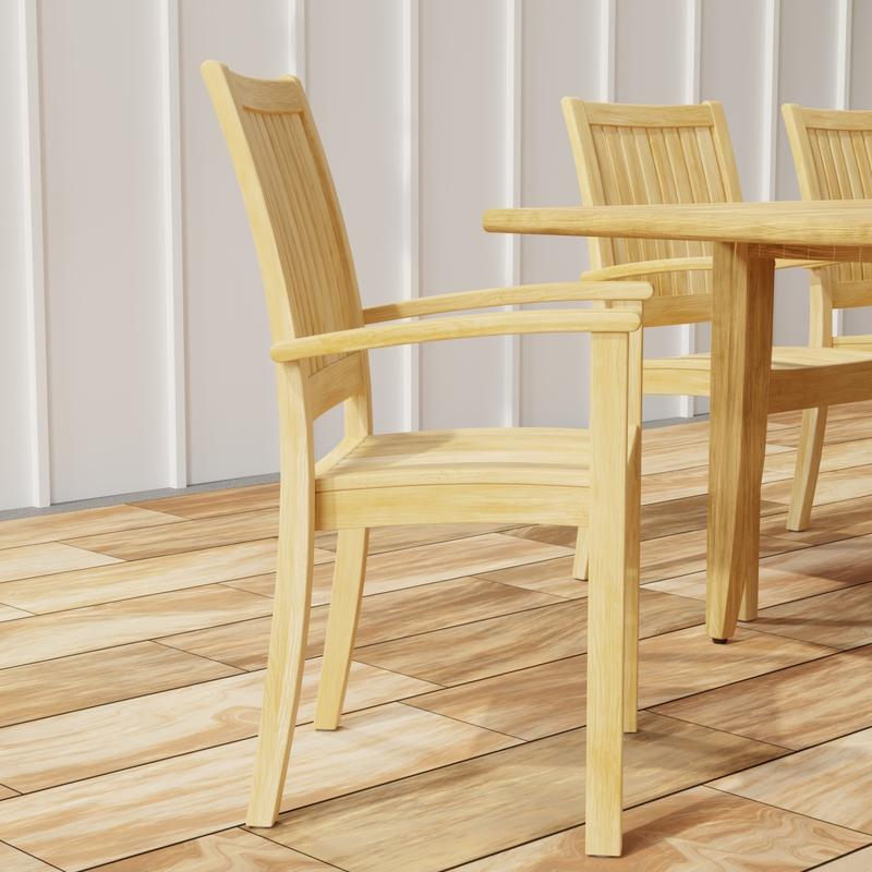 alt="70774 Laguna Sussex 9 pc Teak Dining Set showing closeup end view on wood deck with house in background"