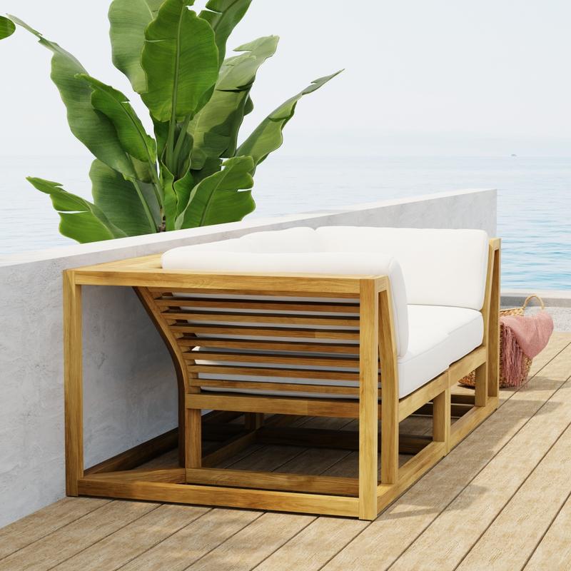 alt="70275 Maya Love Seat of 2 Maya Corner Sectionals in angled end view on wood deck terrace with a plant and ocean and blue sky in the background"