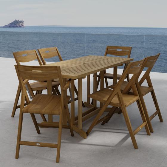 70146 Surf Nevis Teak 7 pc Dining Set of Nevis Dining Table and 2 Surf Dining Chairs and 4 Surf Side Chairs angled end view on tile patio overlooking the ocean in background