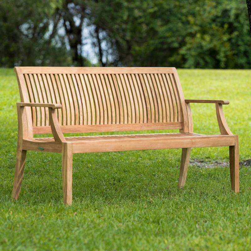 alt="13811 Laguna 5 foot Teak Bench angled on grass in field and trees in background"