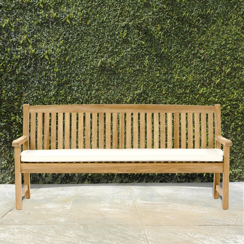 alt="13883 Veranda 6 foot long Teak Bench with optional seat cushion on concrete patio with bushes in background"