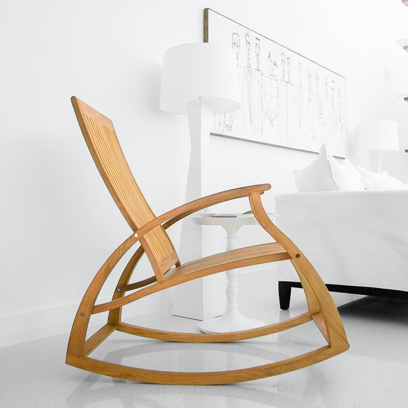 alt="16419dp Aria Rocker side view on marble floor next to white side table and white lamp wall art above white couch in background"