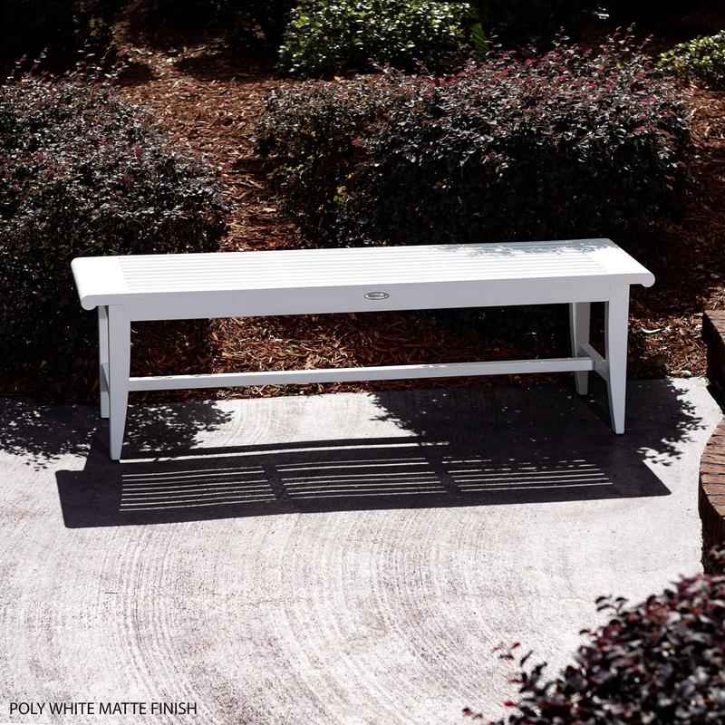 alt="13916 Laguna Teak 5 foot Backless Bench angled view showing white gloss finish on concrete patio with shrubs in background"