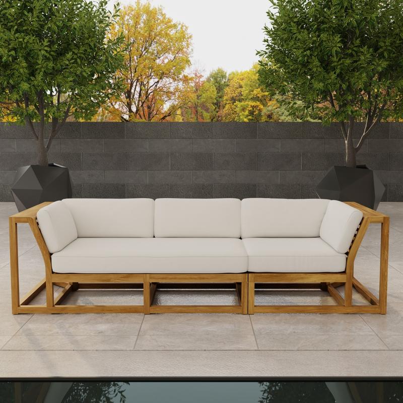 alt="70277 Maya Deep Seating Sofa of Maya Right Side Sofa Sectional and Corner Sectional in front view on patio facing a pool with fence and trees in background"