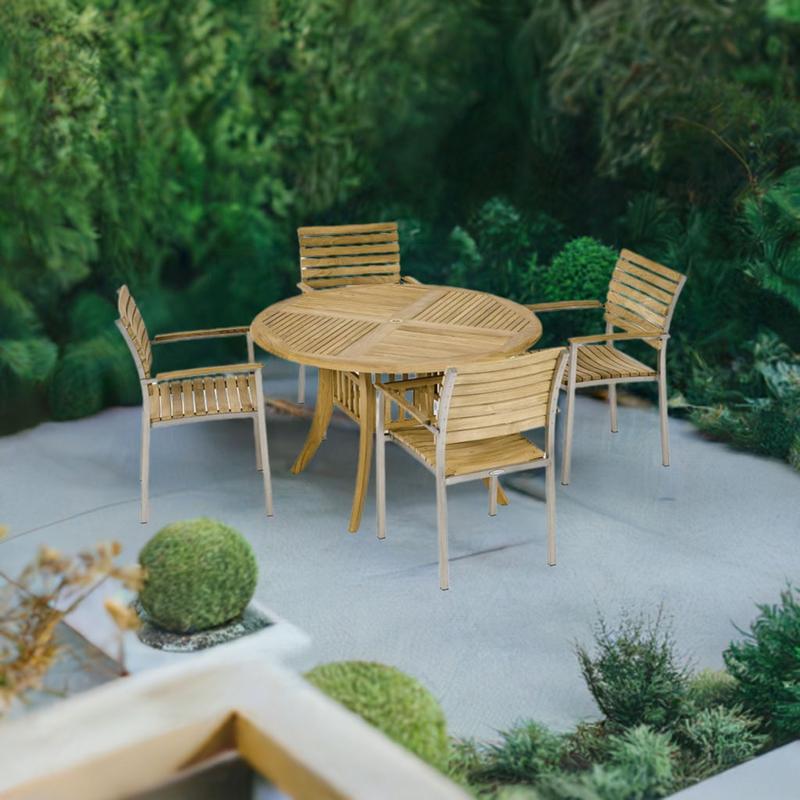 alt="70581 Grand Hyatt Vogue Dining Set of Grand Hyatt Teak 48 inch Round Dining Table and 4 Vogue Dining Chairs on stone patio surrounded by landscaping plants aerial view with trees in background"