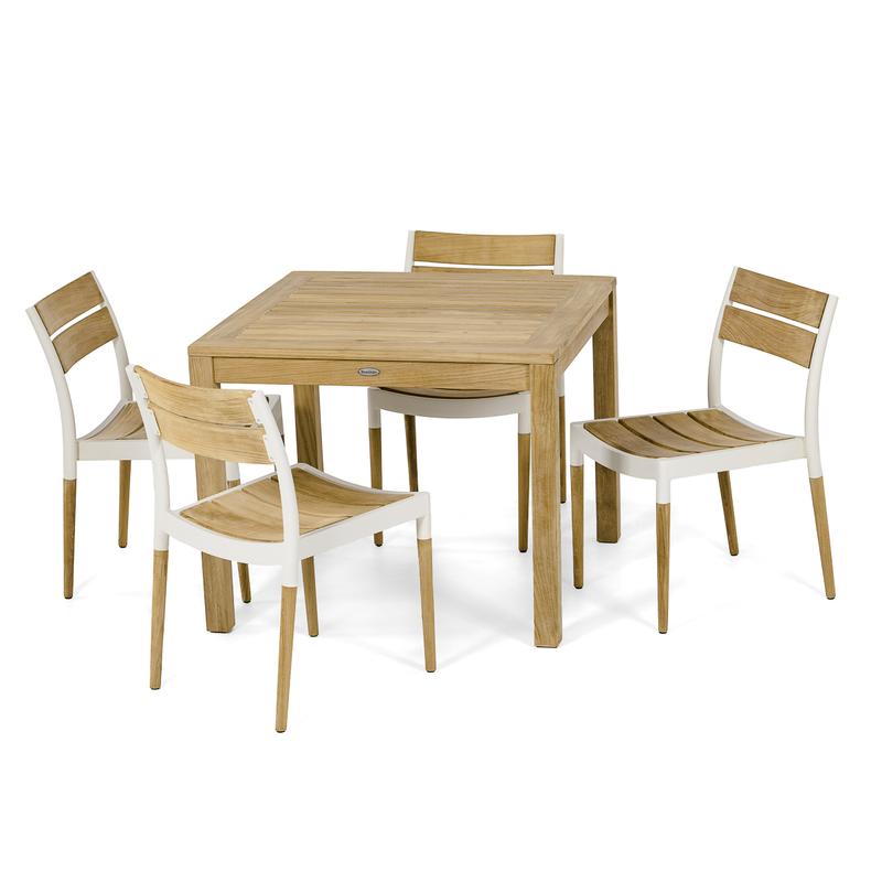 alt="70556 Bloom Teak Dining Set of teak 36 inch square dining table and 4 Bloom teak and powder coated aluminum side chairs angled on white background"