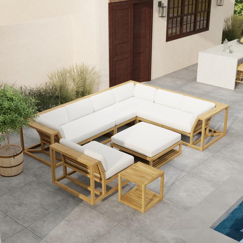 alt="70273 Maya 6pc Sectional Set side angled aerial view on patio next to a pool with landscaping and potted plants with a door and window of house and outdoor bar in background "