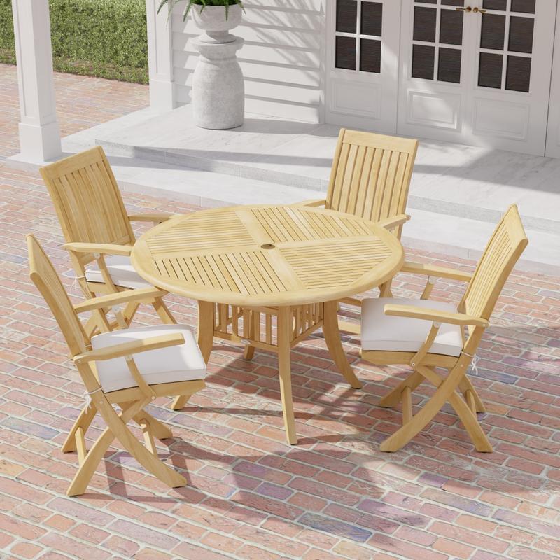 alt="70043 Grand Hyatt Barbuda 5 pc Patio Dining Set of Grand Hyatt Dining Table and 4 Barbuda Folding Chairs angled aerial view on a brick patio with french doors and fern in background"